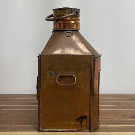 Vintage Copper Ship Lantern - Starboard Fresnel Light with Original Oil Chamber Side view of vintage copper ship lantern showing brass handle and burn marks