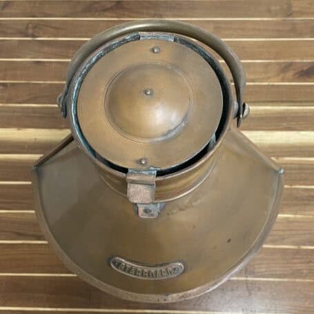 Vintage Copper Ship Lantern - Starboard Fresnel Light with Original Oil Chamber Closed top view of vintage copper ship lantern with handle and “Starboard” tag visible