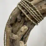 Close-up of rope detail on driftwood wreath with weathered texture