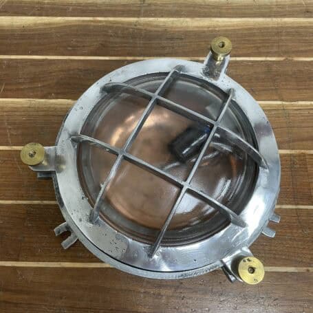 Vintage Aluminum Bulkhead Light with Copper Base and Brass Hardware Top view of vintage aluminum bulkhead light with 4-bar cage and glass dome