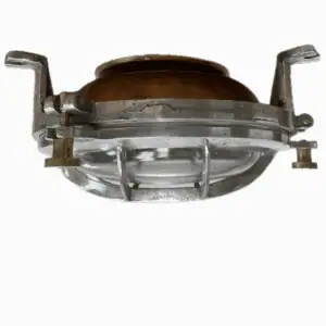 Close-up of copper and aluminum marine light with visible mounting brackets