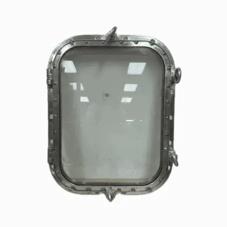Close-up of salvaged four dog aluminum porthole standing upright