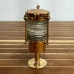 Hinged lid and thumbscrew detail on vintage brass post light