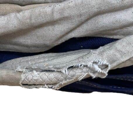 Salvaged Papa Nautical Signal Flag 01 Salvaged Papa nautical signal flag torn rope sleeve detail with fraying and heavy wear