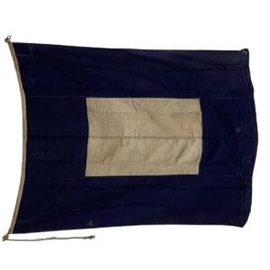 Salvaged Papa nautical signal flag full view showing darkened white center and heavy discoloration