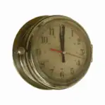 Vintage brass ship clock with 24-hour dial showing side knob and aged face