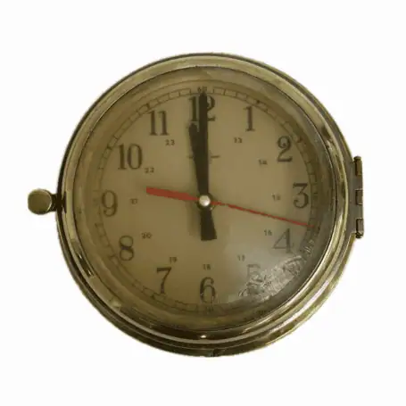 Vintage brass ship clock with 24-hour military-style dial and patina