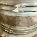 Close-up of Fresnel lens glass chipping on vintage ship lantern