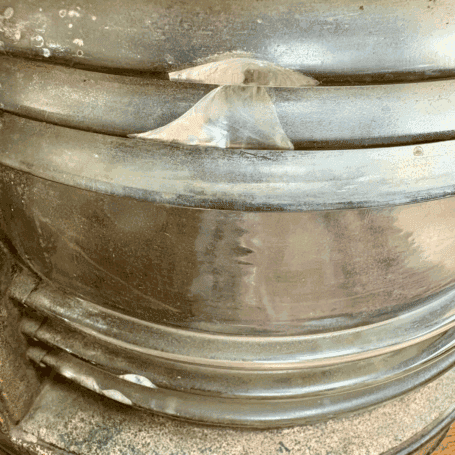 Vintage Copper Fresnel Lens Ship Lantern (2) Close-up of Fresnel lens glass chipping on vintage ship lantern