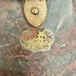 Partial maker’s tag on lantern body showing “Glaslow” engraving