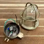 Bottom view showing glass globe and brass base