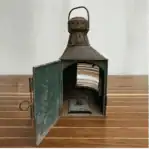 Lantern door open showing Fresnel glass len