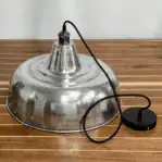 Vintage Aluminum Hood Pendant Light shown on table with cord