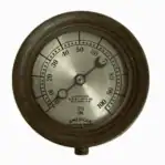 Front dial of vintage brass pressure gauge with 3½ inch face