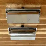 Vintage Chrome Plated Ship Wall Lights showing the tops of both fixtures with visible wear and spotting.