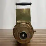 Front view of vintage microamperes meter with brass cover and handle