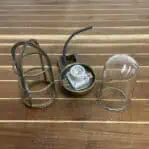 Disassembled brass nautical wall sconce showing parts and wiring