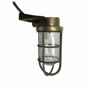 Side view of mounted brass nautical wall sconce against white