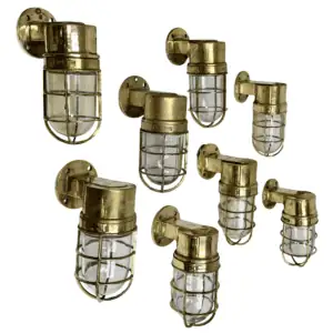 set of 8 vintage brass dock lights front view with glass globes