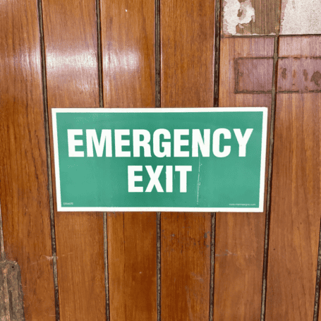 Vintage Ship Door with Porthole (4) Green and white emergency exit sign on salvaged ship door