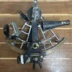 Top view of weathered Osaka Tamaya nautical sextant