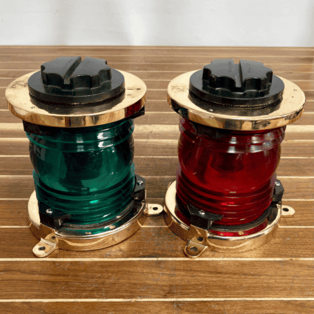PERKO Red and Green Fresnel Navigation Light Set (5) PERKO Brass Navigation Light Set angled view on wood surface