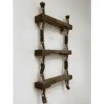 Side angle (alternative): Close-up side view of 3-step wooden ladder shelf with red accents and rope sides