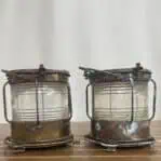 Patina and corrosion on aged brass navigation lights from side view