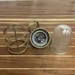 Ribbed glass globe removed from brass cage