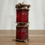 Dual red Fresnel lenses brass housing side view