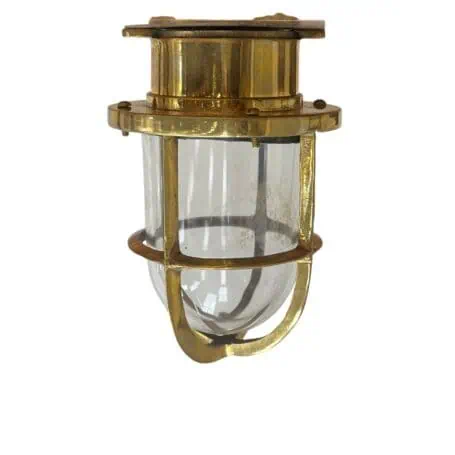 Brass nautical ceiling light side view showing solid brass housing and glass globe