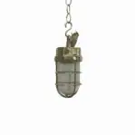 Brass pendant cage light hanging from brass chain