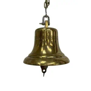 brass bell hanging from a chain