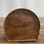 Bottom plate of vintage nautical running light with patina