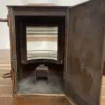 Interior view of nautical running light showing lens and base