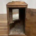 Open copper navigation light with rear door access and interior view