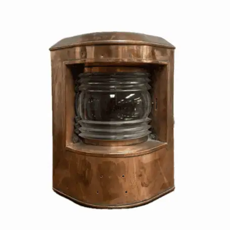 Front view of light showing clear Fresnel lens and copper housing