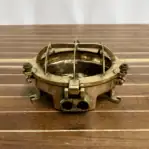marine brass light housing profile on flat surface