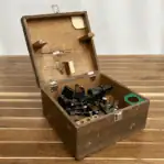 Vintage Tamaya Tokyo Drum Sextant resting inside original wooden storage case