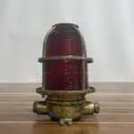 marine light showing one mounting leg and two conduits