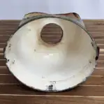 Interior of brass lid showing underside construction