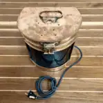 Top view of green marine lantern lid with mounting holes
