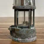 vintage Eccles miners safety lamp base detail with patina and wear