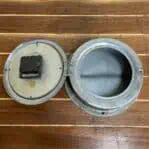 aluminum ship clock interior with battery movement and open case