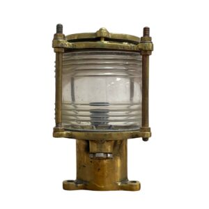 brass marine light with Fresnel lens detail and patina finish