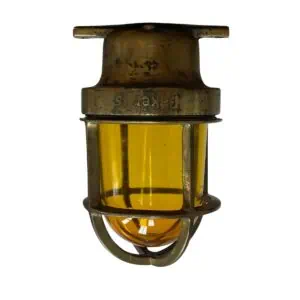 small brass baker ceiling light with amber glass front view cage and globe