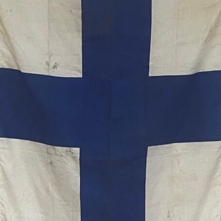 Finland Ship Flag - 58 x 39 02 Close-up of the blue Nordic cross on a Finland ship flag showing maritime wear and discoloration