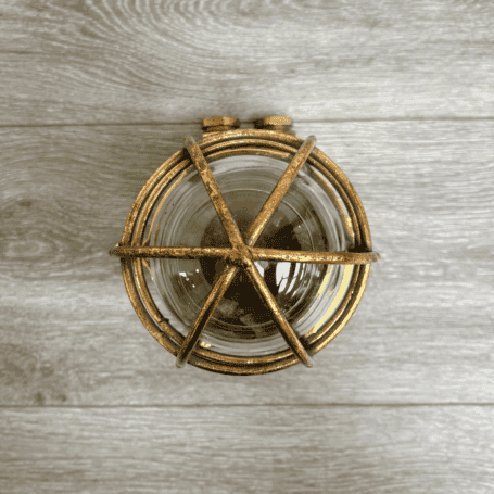 Vintage Brass Caged Ship Light with Dual Conduits (5) Top view of brass caged ship light showing cage, glass globe, and brass housing